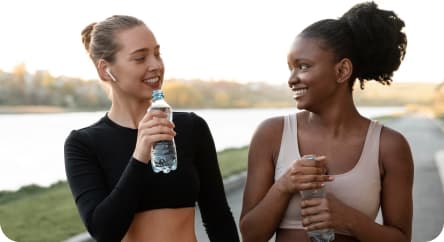 Two women drink water